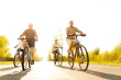 stock-photo-23002430-four-seniors-biking-on-road